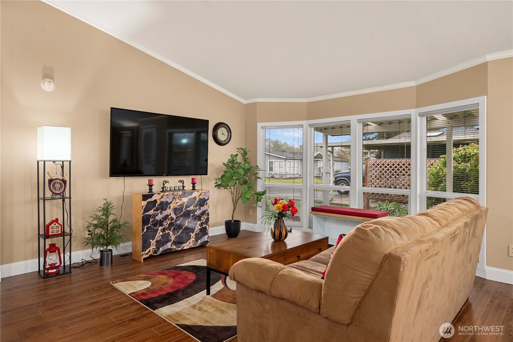 836 Harman Way South, Unit 62 Orting, WA 98360 - Photo 7 of 40 a living room with furniture fireplace and a flat screen tv