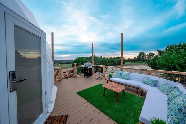 a view of a patio with couches chairs dining table and chairs