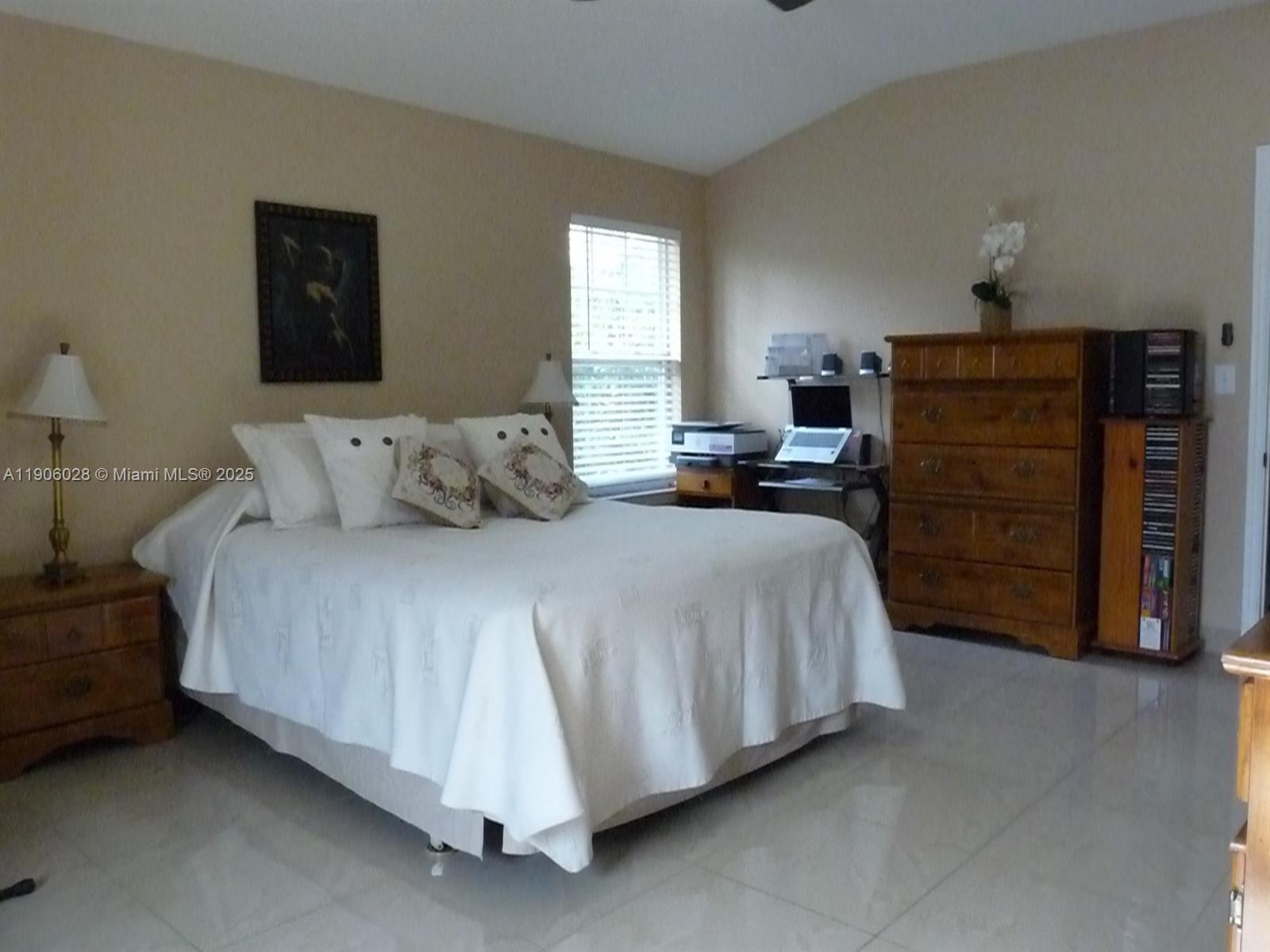 400 Summit Ridge Place, Unit 216 Longwood, FL 32779 - Photo 11 of 25 a bedroom with a bed and furniture