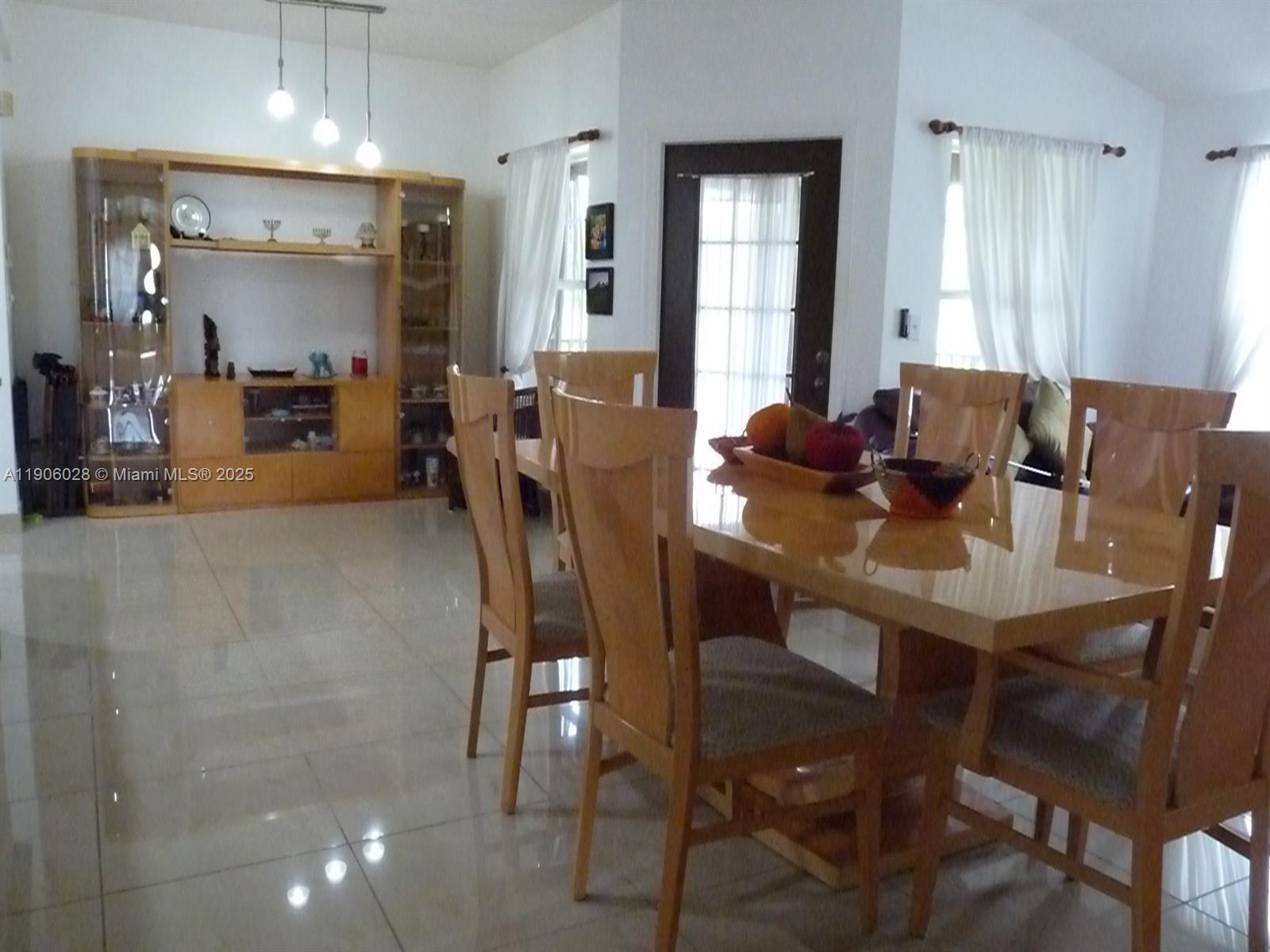 400 Summit Ridge Place, Unit 216 Longwood, FL 32779 - Photo 18 of 25 a view of a dining room with furniture