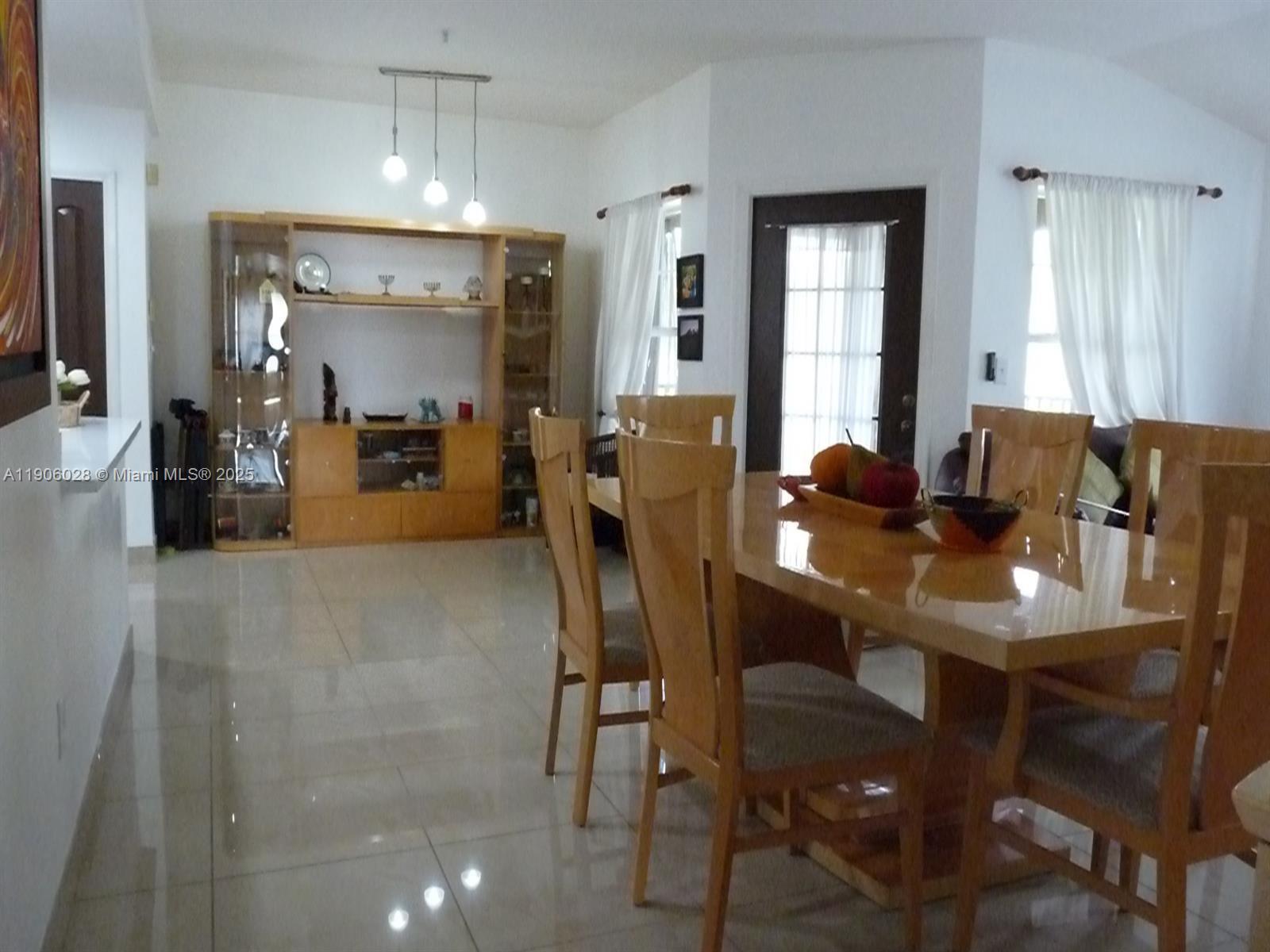 400 Summit Ridge Place, Unit 216 Longwood, FL 32779 - Photo 19 of 25 a view of a dining room with furniture