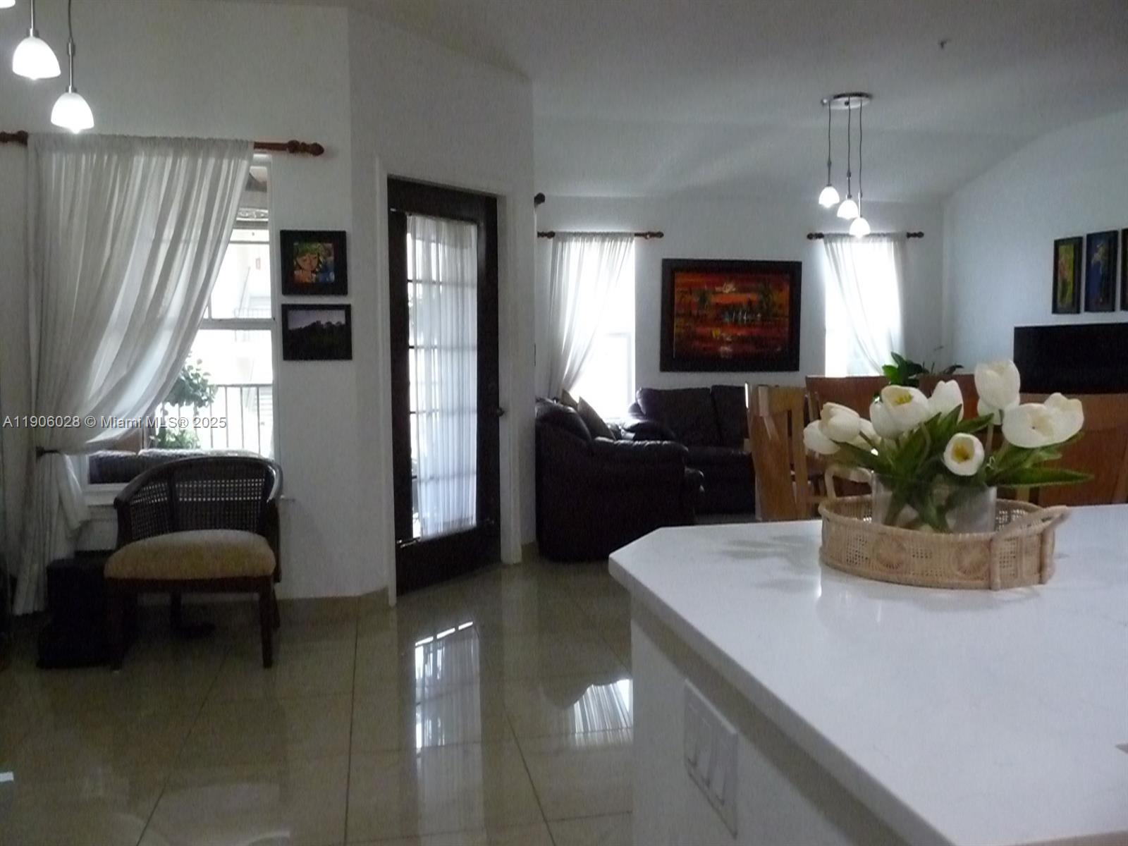 400 Summit Ridge Place, Unit 216 Longwood, FL 32779 - Photo 23 of 25 a dining room with furniture and window