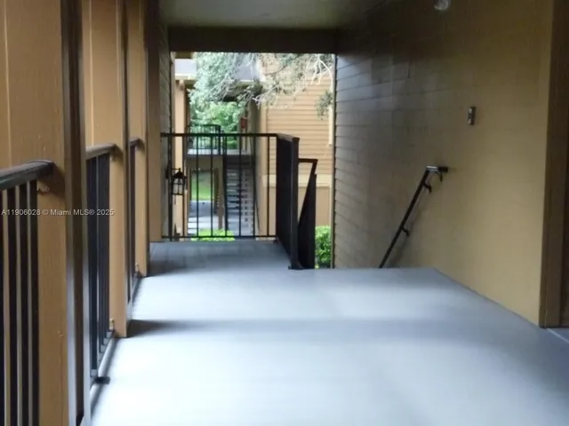 a view of empty room with floor to ceiling window