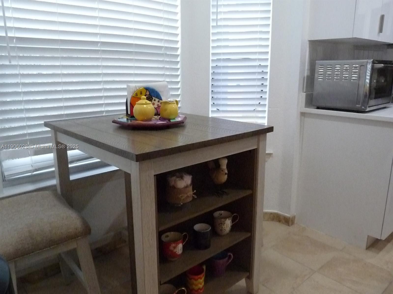 400 Summit Ridge Place, Unit 216 Longwood, FL 32779 - Photo 4 of 25 a room with a table chairs and a window