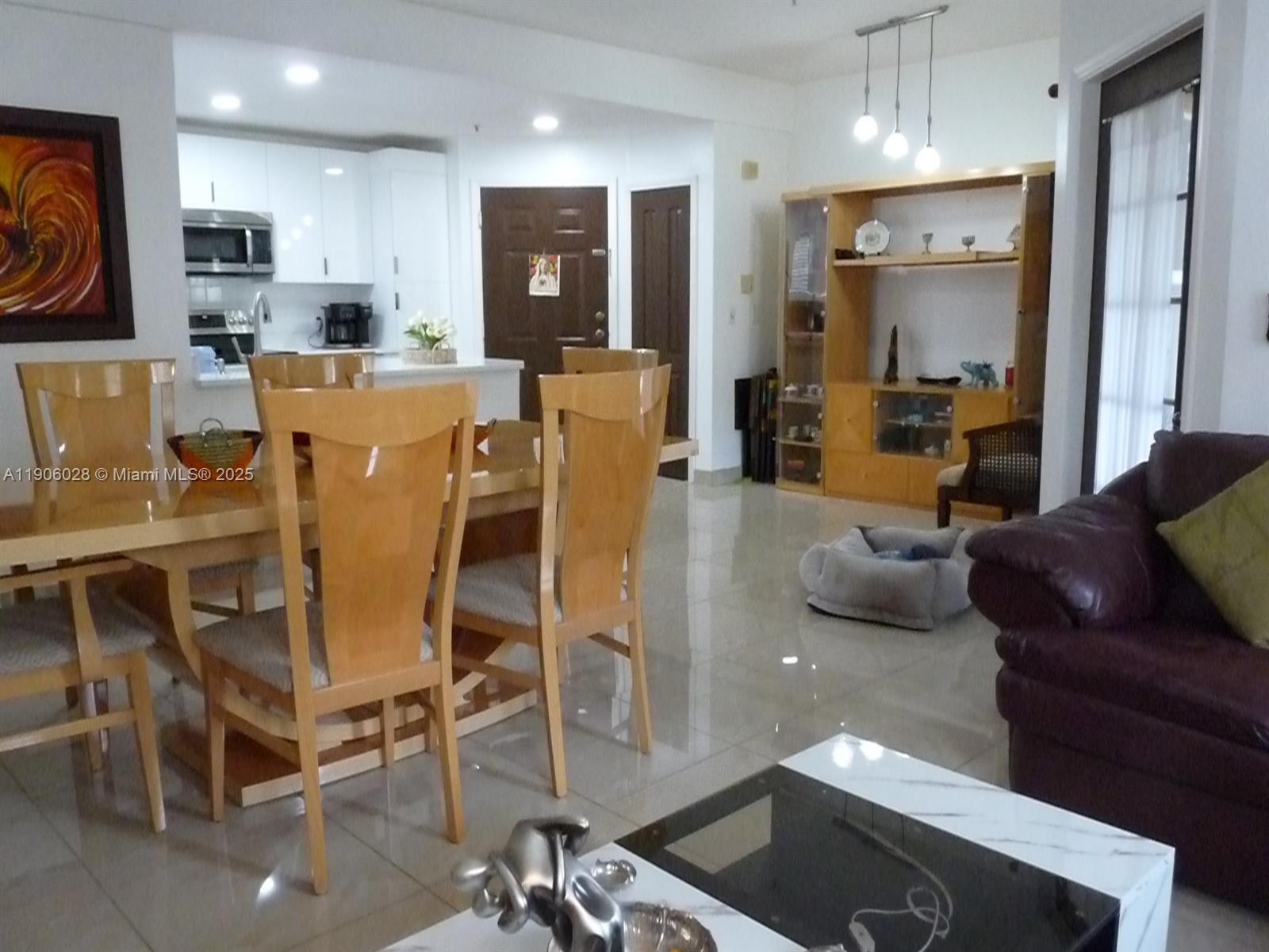 400 Summit Ridge Place, Unit 216 Longwood, FL 32779 - Photo 6 of 25 a living room with furniture kitchen and a table