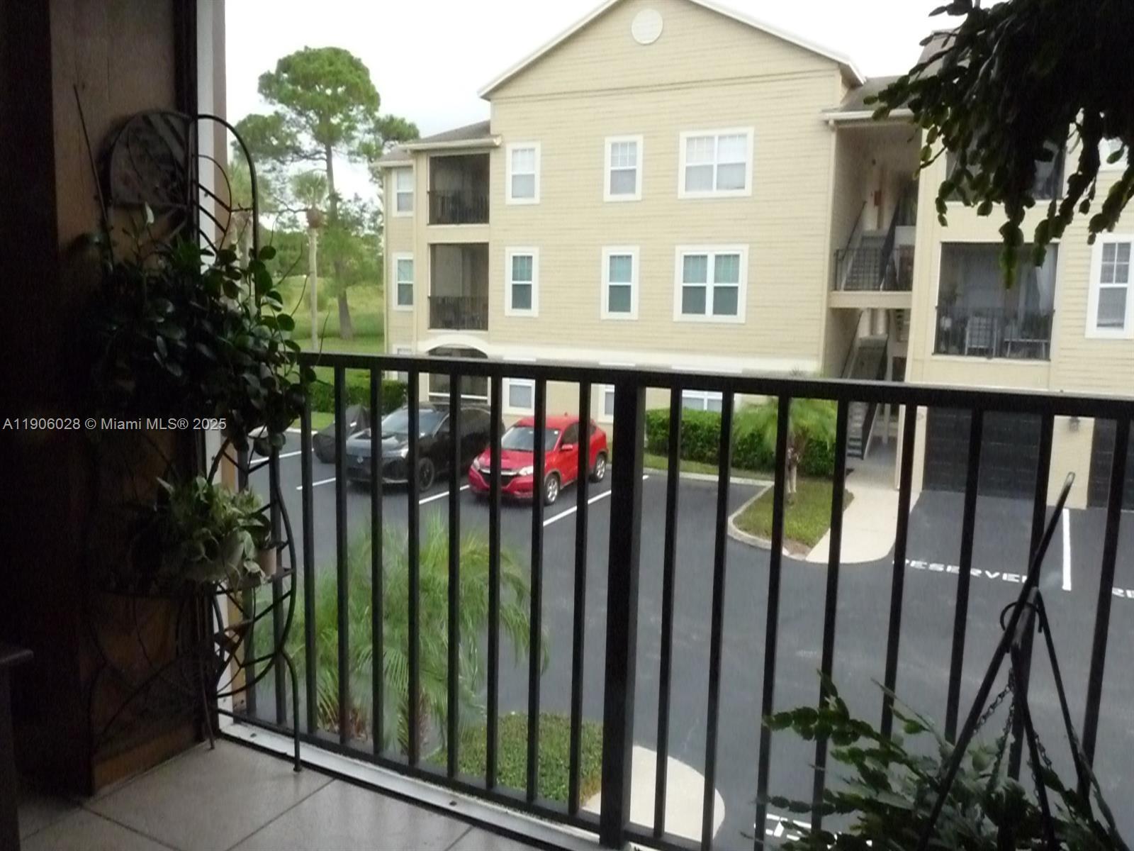 400 Summit Ridge Place, Unit 216 Longwood, FL 32779 - Photo 9 of 25 a view of a large building with a flower garden