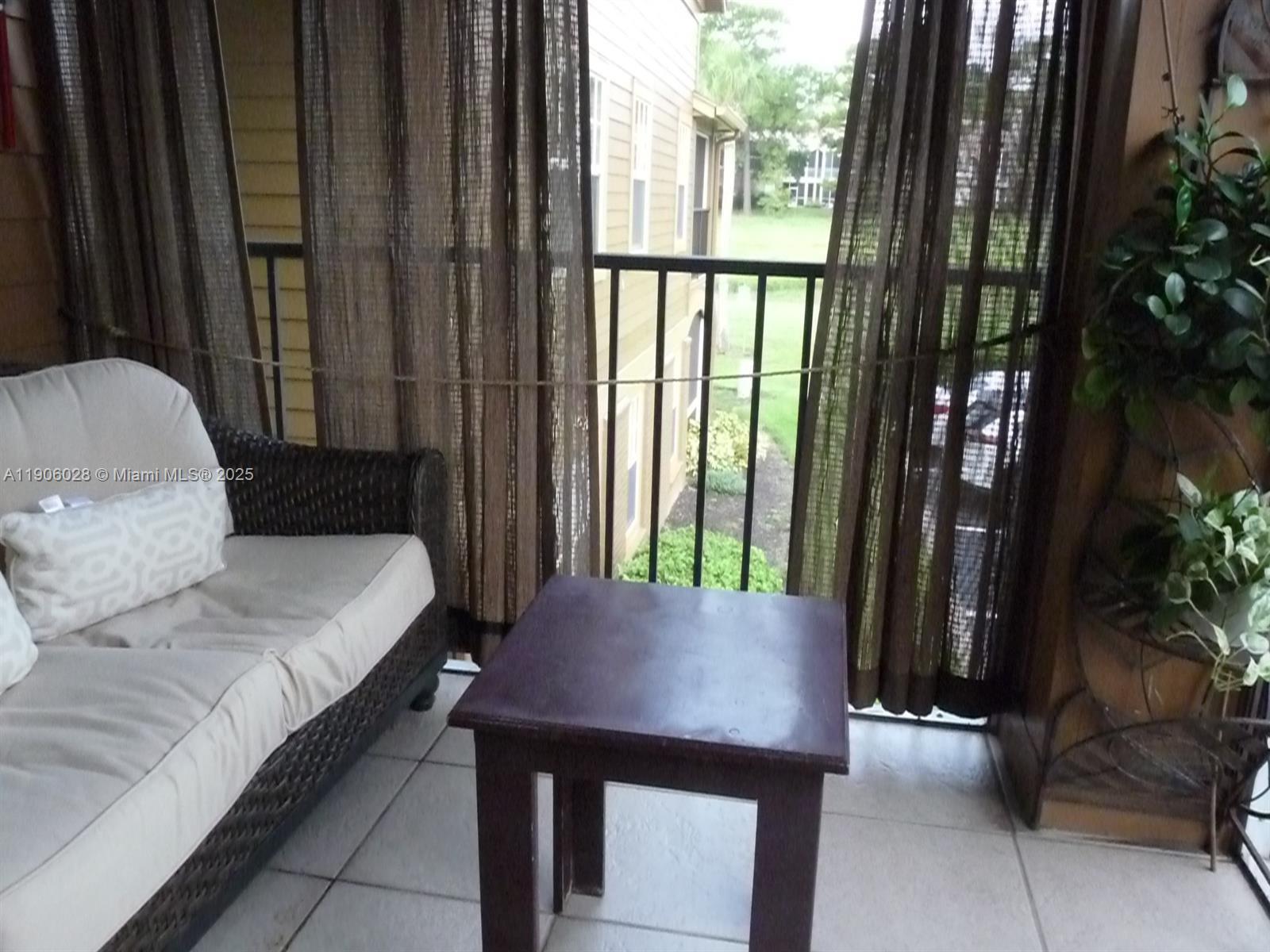 400 Summit Ridge Place, Unit 216 Longwood, FL 32779 - Photo 10 of 25 a living room with furniture and a window