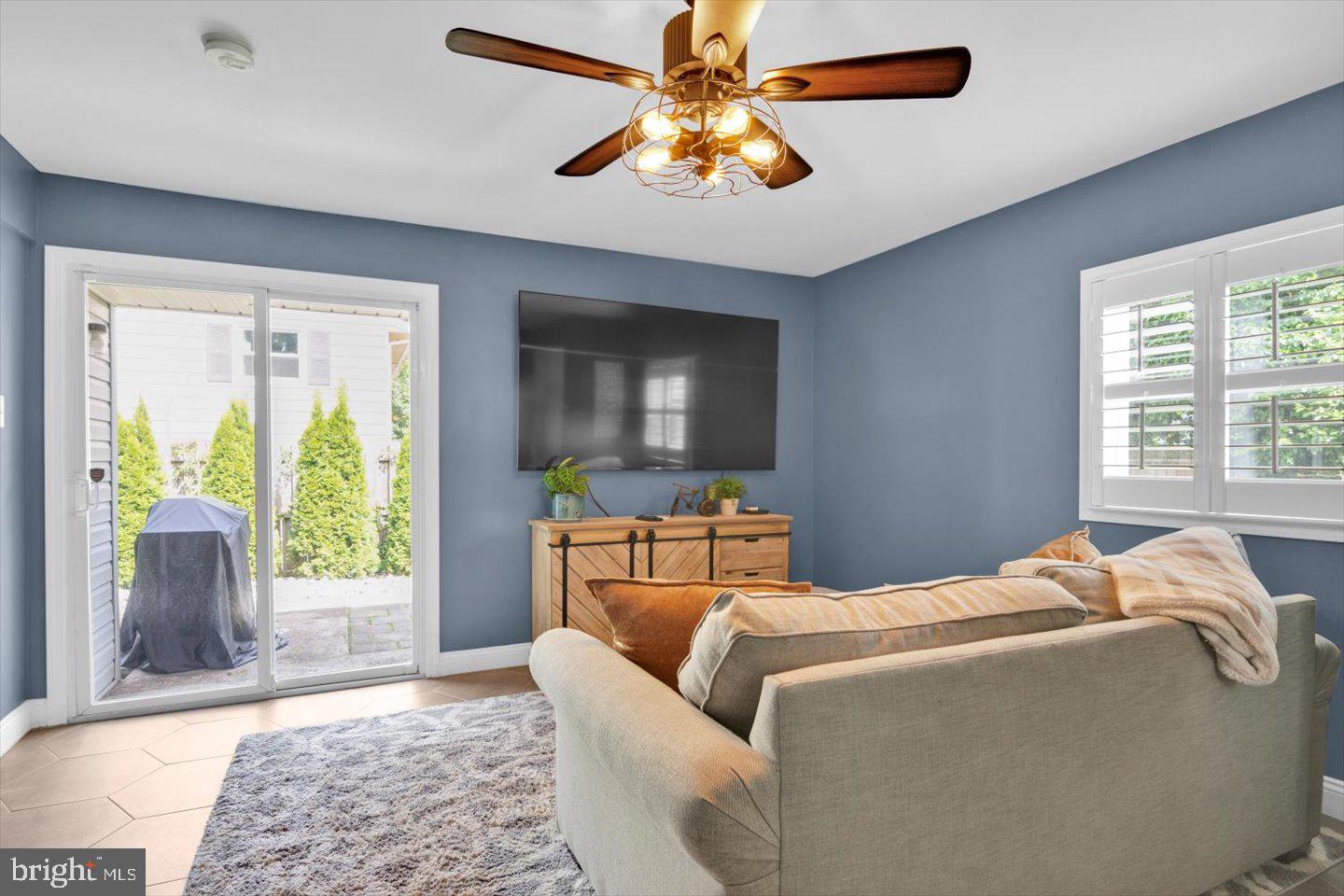 1102 Cooperskill Road Cherry Hill, NJ 08034 - Photo 15 of 38 a bedroom with a bed and glass window