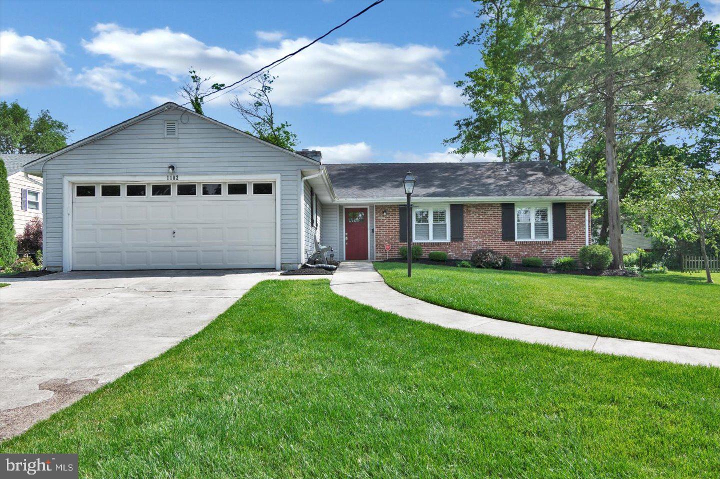 1102 Cooperskill Road Cherry Hill, NJ 08034 - Photo 2 of 38 a front view of a house with a garden and yard
