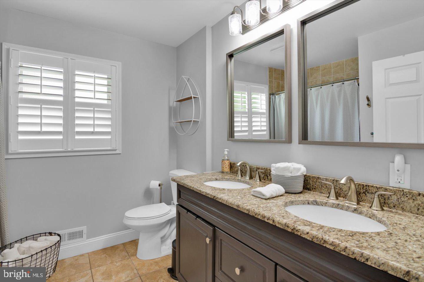 1102 Cooperskill Road Cherry Hill, NJ 08034 - Photo 26 of 38 a bathroom with a granite countertop double vanity sink a mirror and a toilet