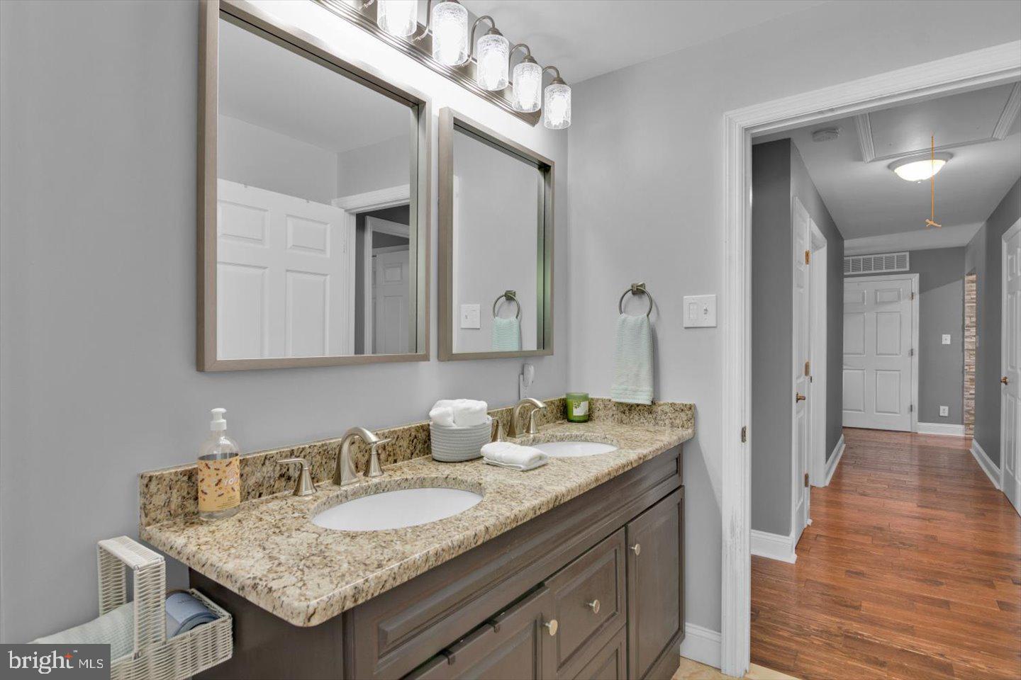 1102 Cooperskill Road Cherry Hill, NJ 08034 - Photo 27 of 38 a bathroom with a granite countertop sink and a mirror