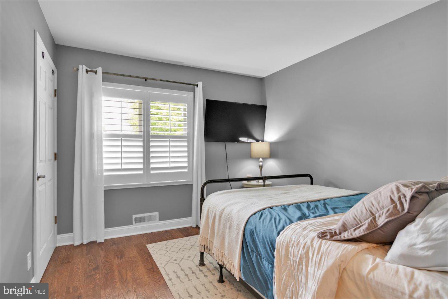 1102 Cooperskill Road Cherry Hill, NJ 08034 - Photo 30 of 38 a bedroom with a bed and a flat tv screen