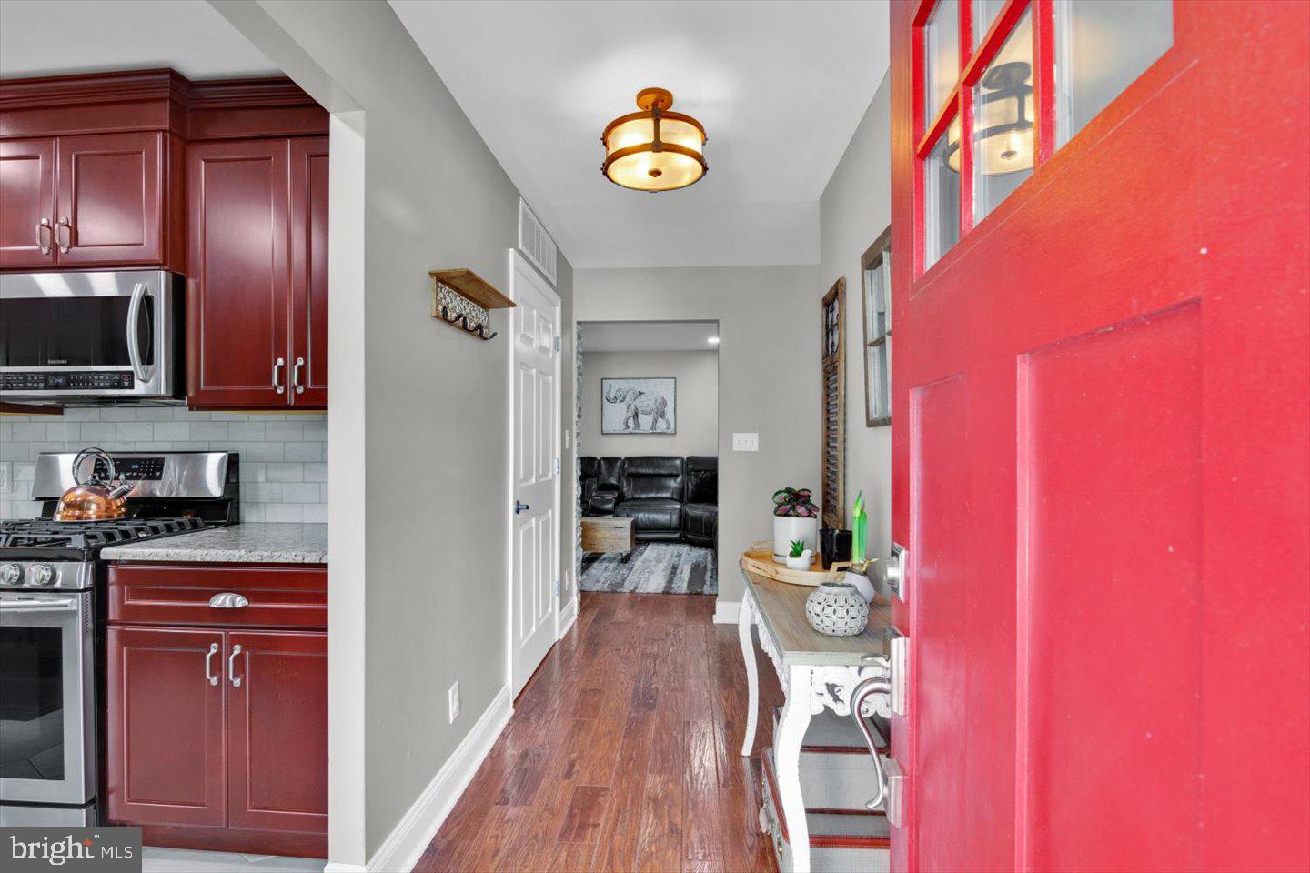 1102 Cooperskill Road Cherry Hill, NJ 08034 - Photo 3 of 38 a kitchen with a refrigerator a stove and cabinets