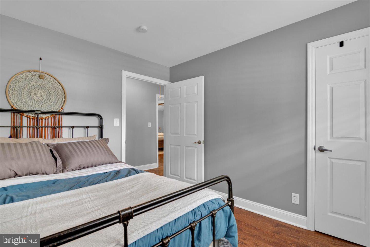 1102 Cooperskill Road Cherry Hill, NJ 08034 - Photo 31 of 38 a bedroom with a bed and wooden floor