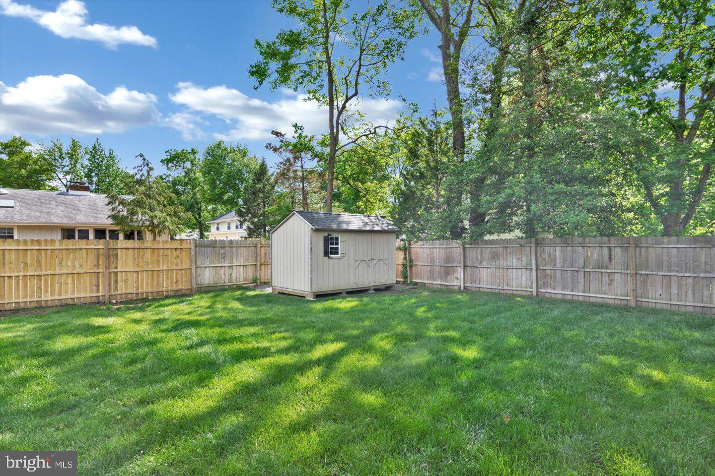 1102 Cooperskill Road Cherry Hill, NJ 08034 - Photo 37 of 38 a view of a backyard with a house and a large tree