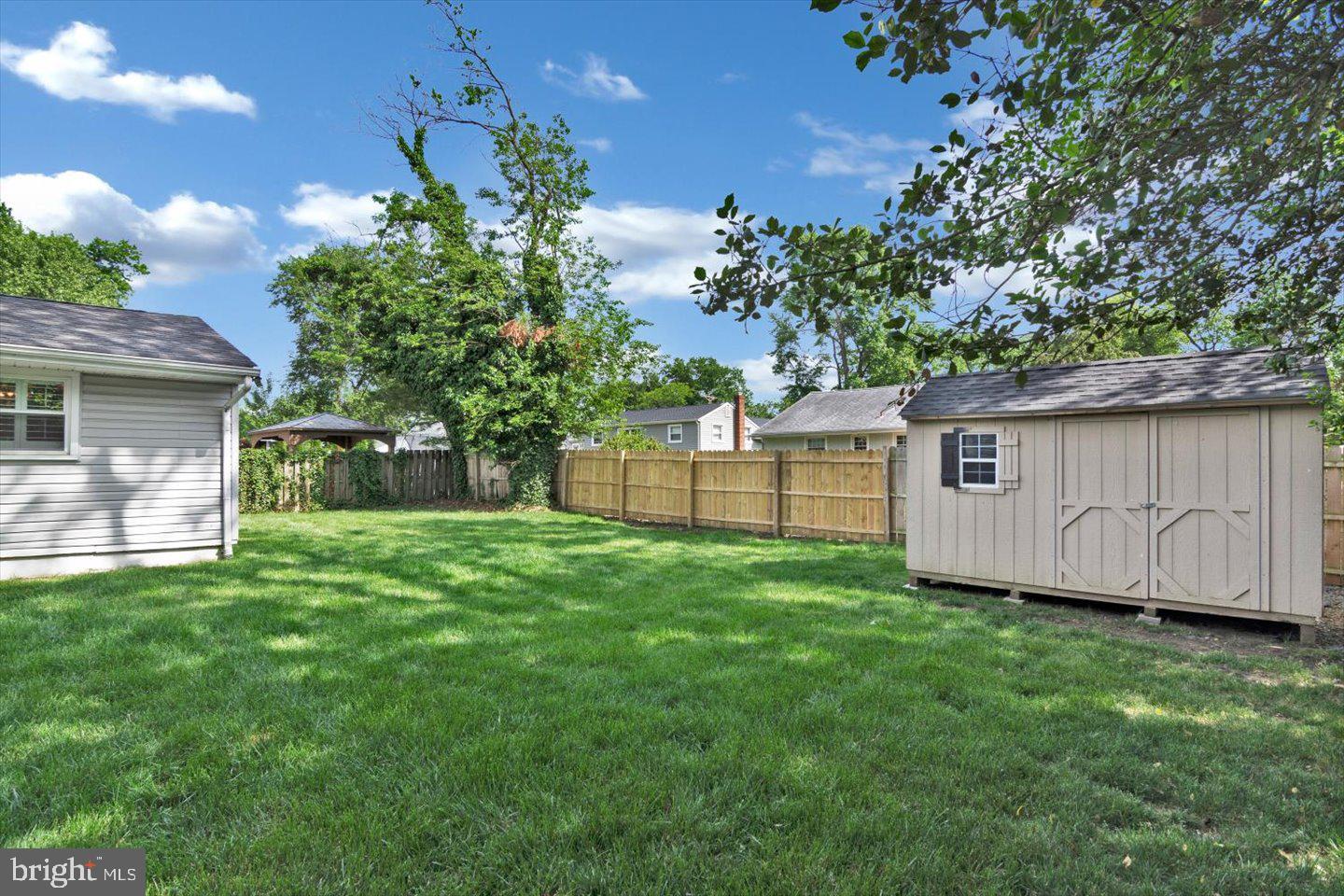 1102 Cooperskill Road Cherry Hill, NJ 08034 - Photo 38 of 38 a view of a backyard with potted plants and large tree