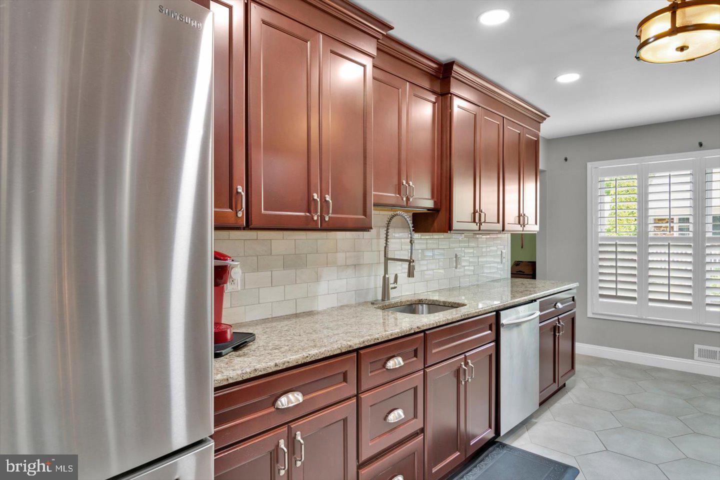 1102 Cooperskill Road Cherry Hill, NJ 08034 - Photo 6 of 38 a kitchen with stainless steel appliances granite countertop a sink and a granite counter tops