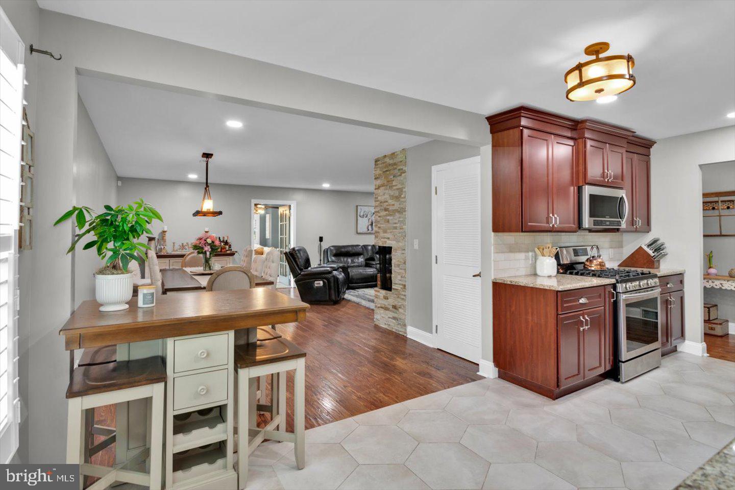 1102 Cooperskill Road Cherry Hill, NJ 08034 - Photo 10 of 38 a kitchen with kitchen island granite countertop lots of counter top space and stainless steel appliances