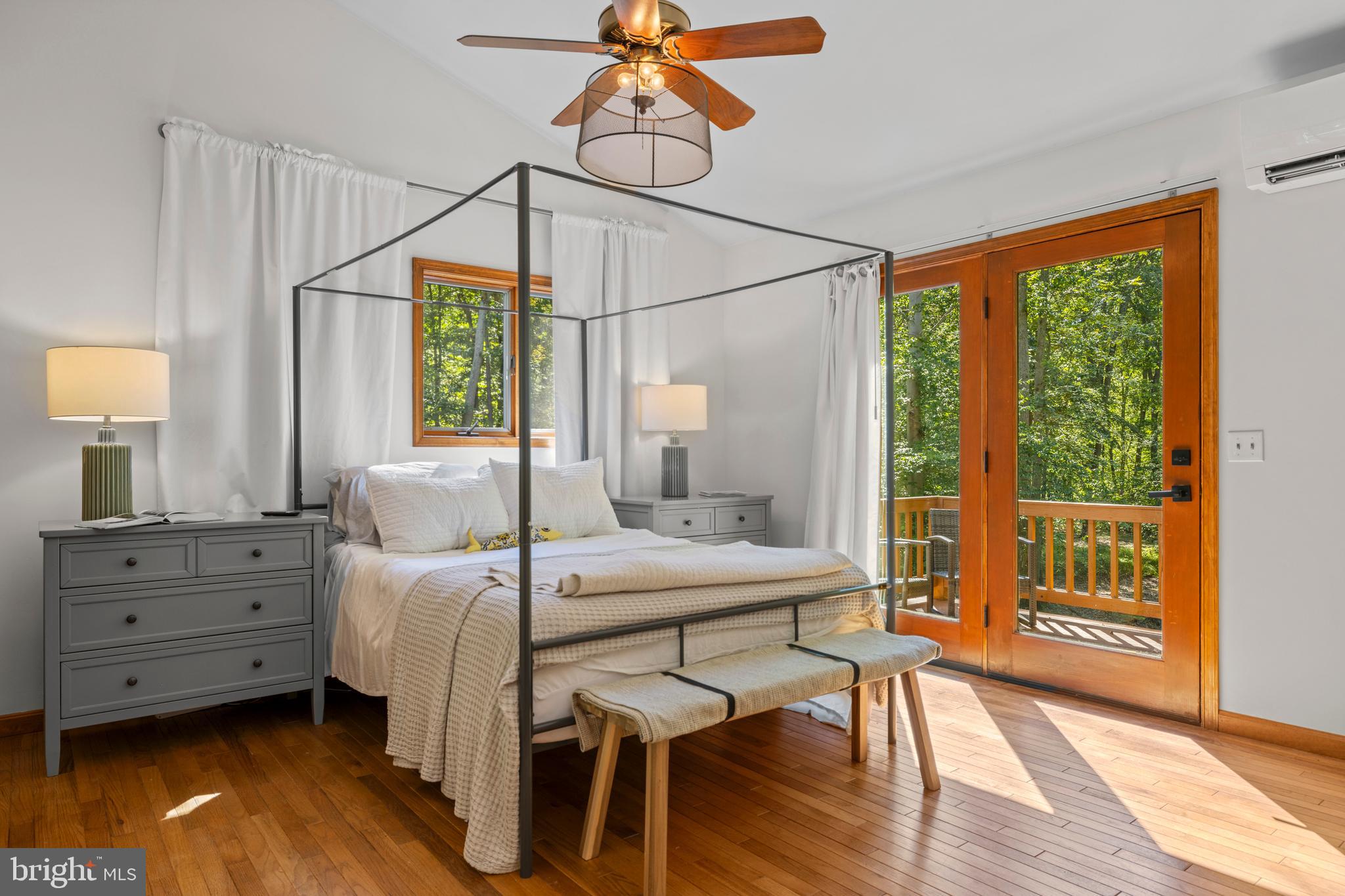 10050 Forrest Lane Chestertown, MD 21620 - Photo 22 of 49 a bedroom with a bed and wooden floor