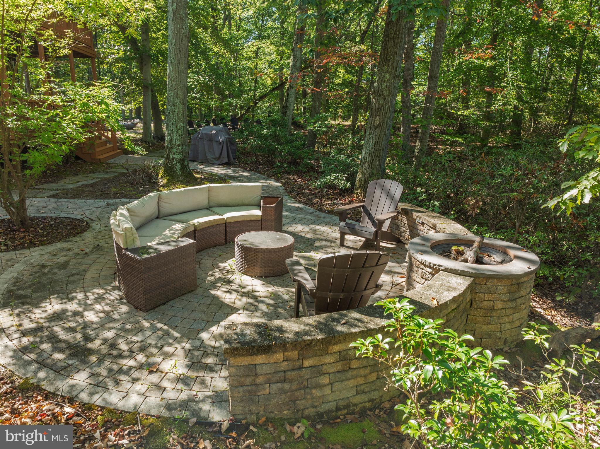 10050 Forrest Lane Chestertown, MD 21620 - Photo 27 of 49 a view of a backyard with sitting area and garden