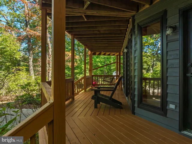 a view of a two chairs in the balcony