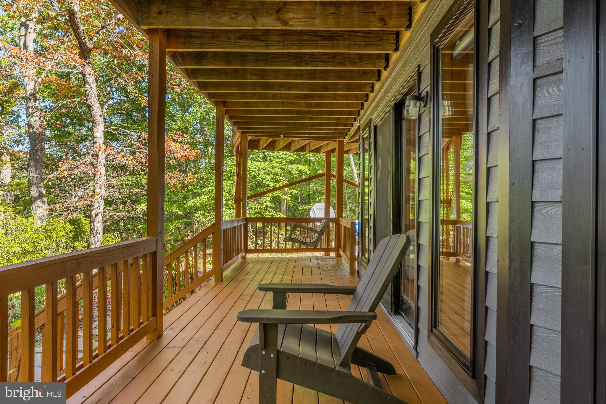 10050 Forrest Lane Chestertown, MD 21620 - Photo 33 of 49 a view of a porch with wooden floor and outdoor seating
