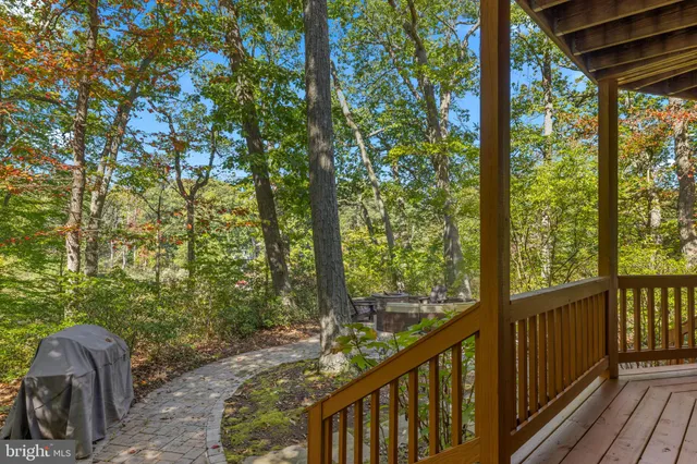 a view of a porch with wooden floor and outdoor space