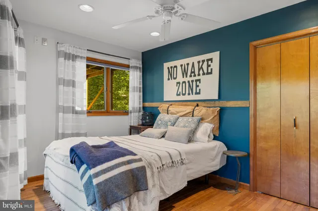 a bedroom with a bed and window