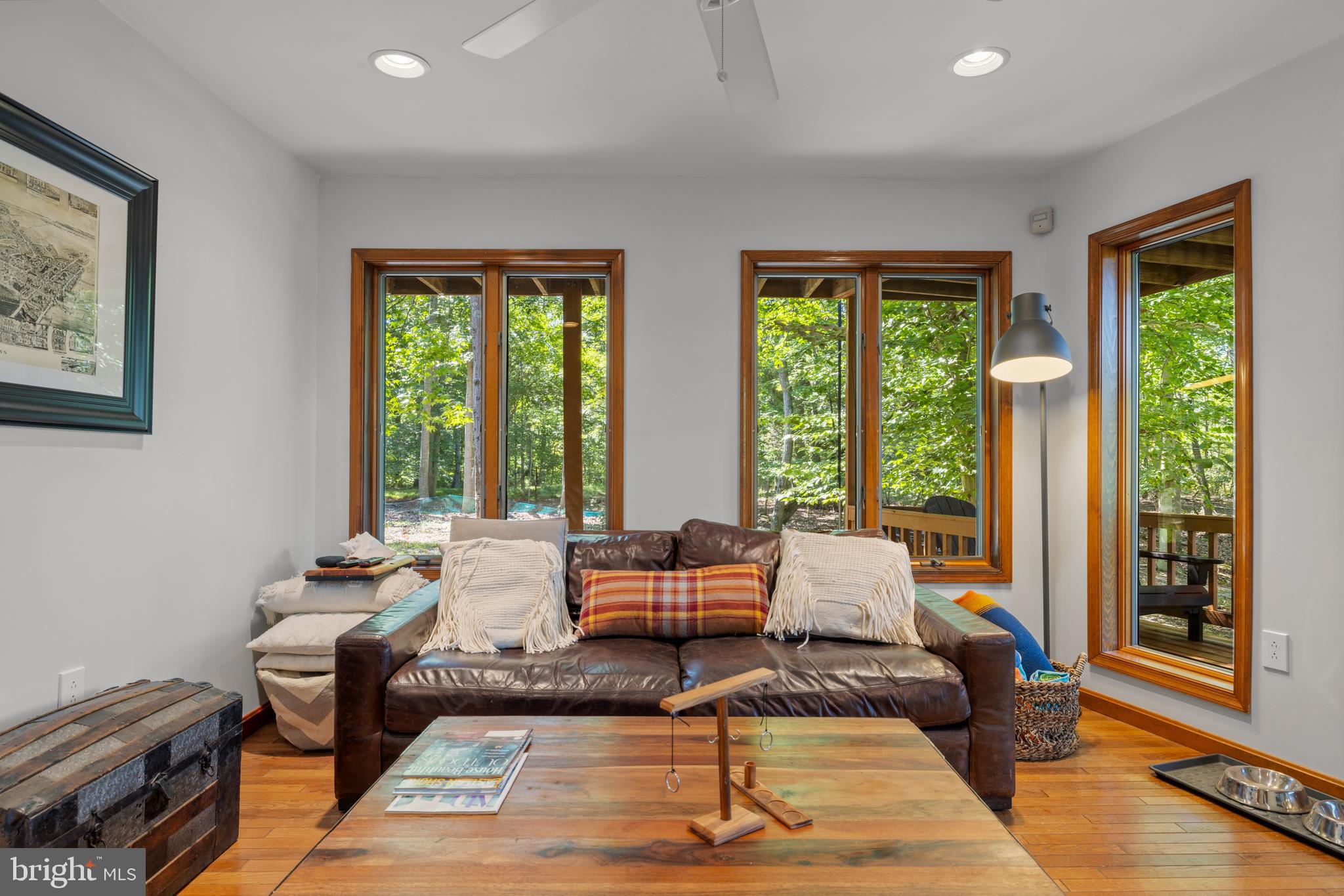 10050 Forrest Lane Chestertown, MD 21620 - Photo 40 of 49 a living room with furniture and floor to ceiling windows