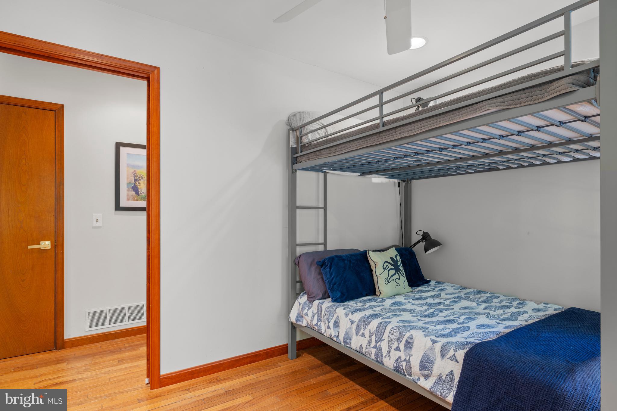 10050 Forrest Lane Chestertown, MD 21620 - Photo 44 of 49 a bedroom with a bed and wooden floor