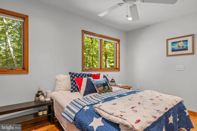 a bed room with a bed and a window