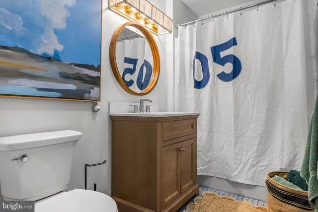 a bathroom with a toilet and a sink