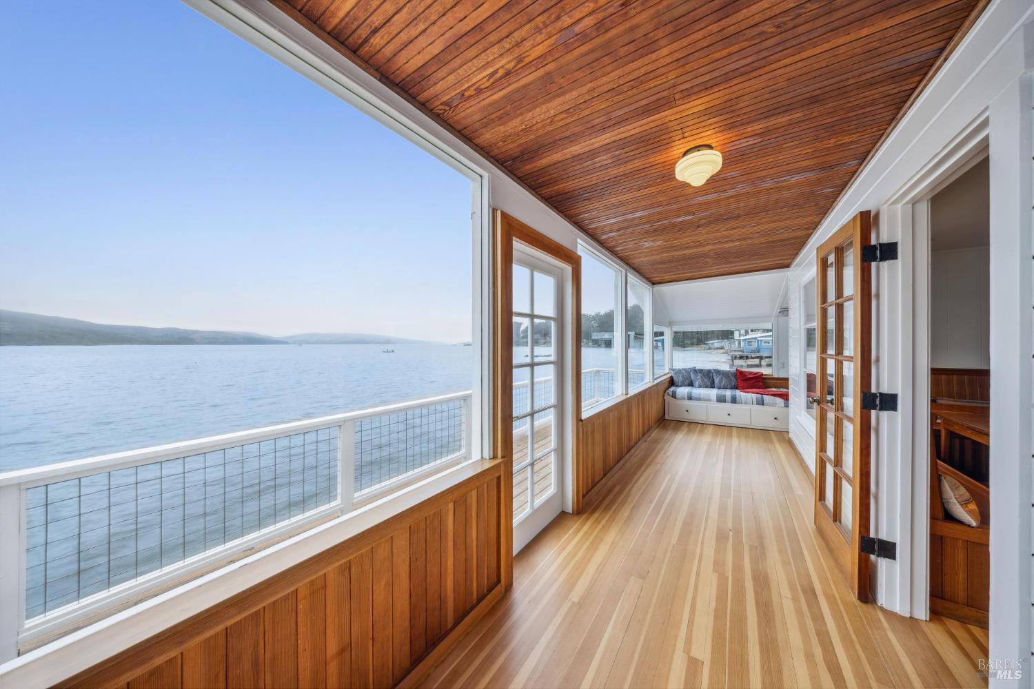 a view of a balcony with wooden floor