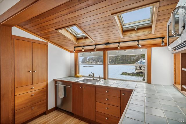 a room with a sink and a large window