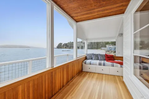a view of balcony with furniture