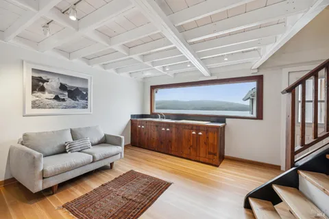 a living room with furniture and a rug