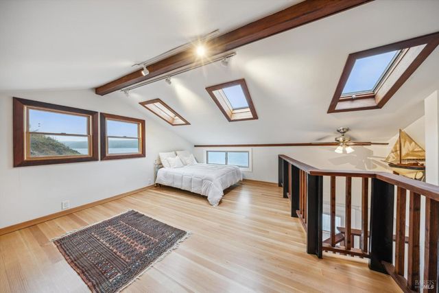 a bedroom with furniture and a window