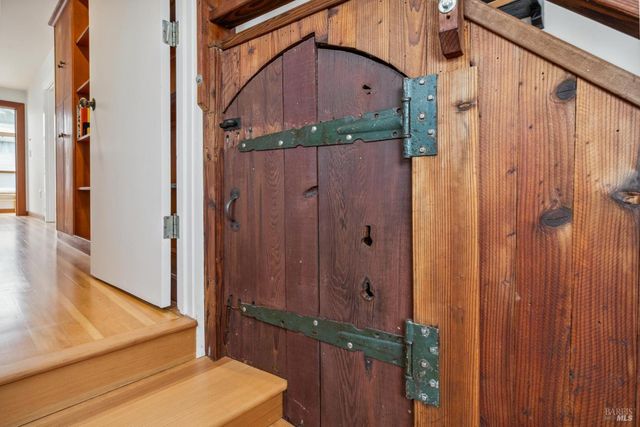 a view of an entryway with wooden floor