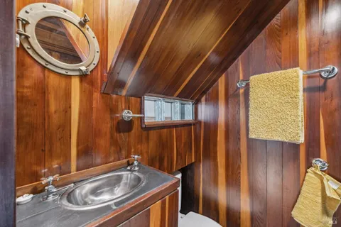 a bathroom with a sink a mirror and shower