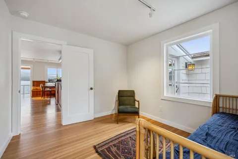 a bedroom with furniture and a window