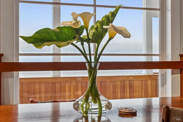 a vase of flowers sitting on a table