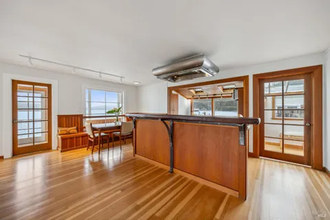 a view of a livingroom with furniture window and wooden floor