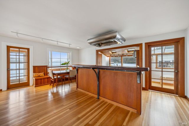 a view of a livingroom with furniture window and wooden floor