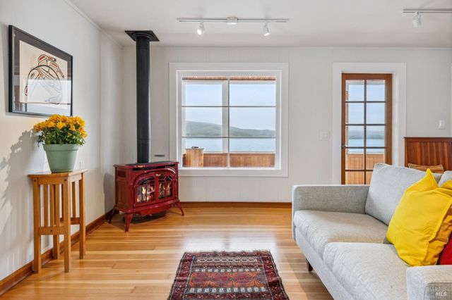 a living room with furniture and a rug
