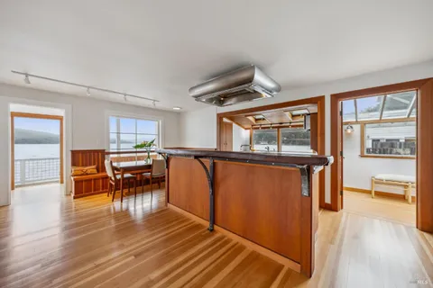a view of a room with furniture window and wooden floor