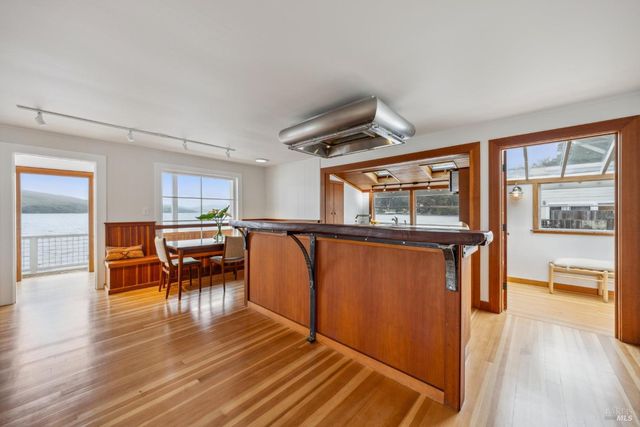 a view of a room with furniture window and wooden floor