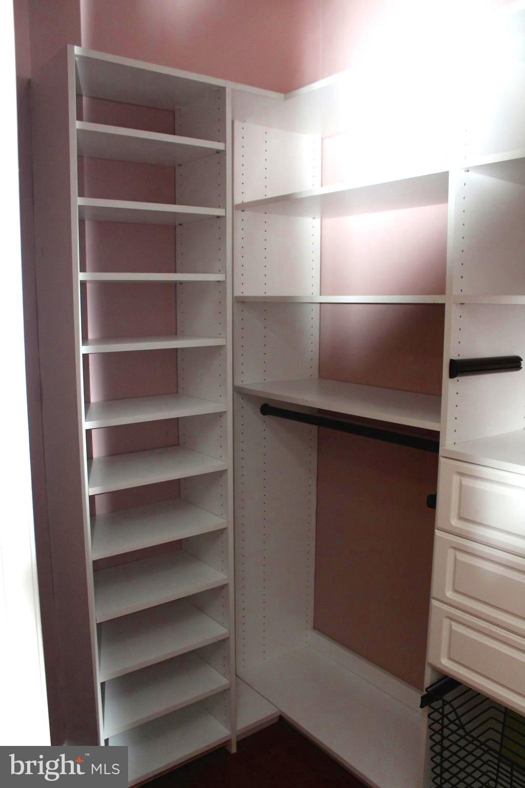 1520 North Point Drive, Unit 104 Reston, VA 20194 - Photo 11 of 26 Walk-in Closet with Custom Cabinets