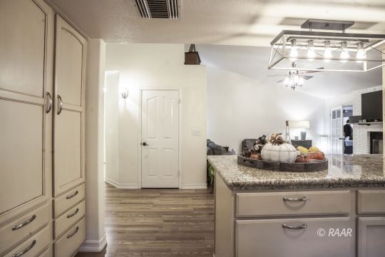 532 Amanda Street Ridgecrest, CA 93555 - Photo 5 of 35 a bathroom with a granite countertop sink and a mirror