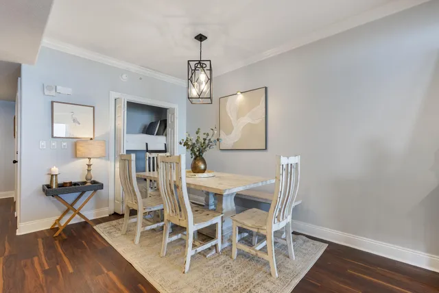 a living room with furniture and a dining table