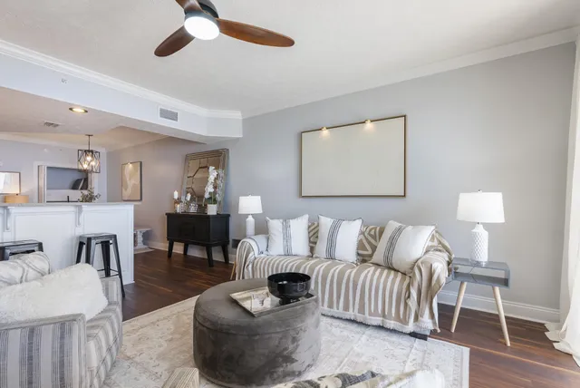 a view of a living room with furniture and a window
